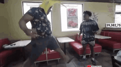 Man In Banana Hat Dancing In Diner GIF
