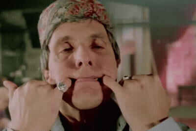 Man In Bandana Making Funny Face With Hands GIF