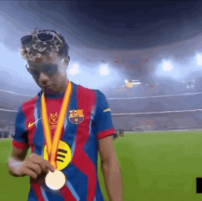 Man In Barcelona Shirt Holding Gold Medal GIF