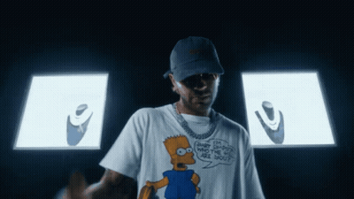 Man In Bart Simpson T-Shirt In Front Of Screen GIF