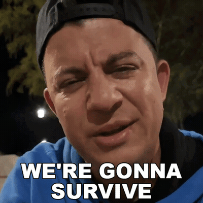 Man In Baseball Cap And Blue Shirt Says We're Gonna Survive GIF