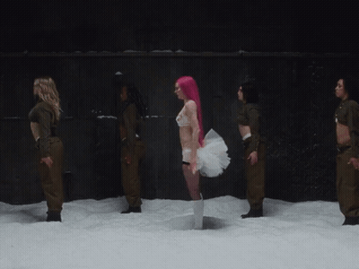 Man In Baseball Cap And Pink Scarf Says Can You Believe It GIF