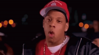 Man In Baseball Cap And Red Shirt Pointing GIF