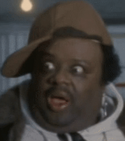 Man In Baseball Cap And Tie Making Funny Face GIF
