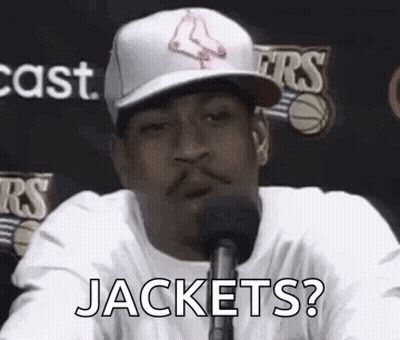 Man In Baseball Cap Asking Jackets Into Microphone GIF