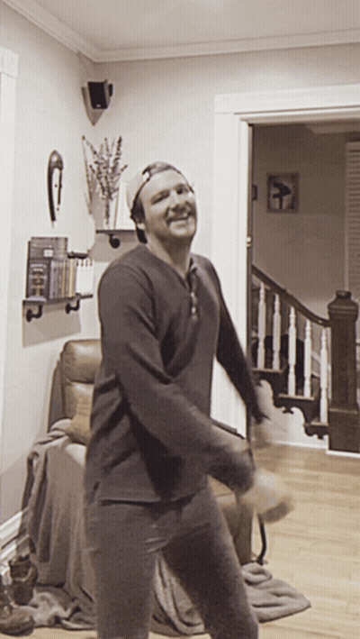 Man In Baseball Cap Dancing In Living Room GIF