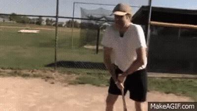 Man In Baseball Cap Holding Baseball Bat GIF