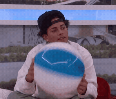 Man In Baseball Cap Holding Beach Ball GIF