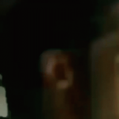 Man In Baseball Cap Looking Out Window GIF