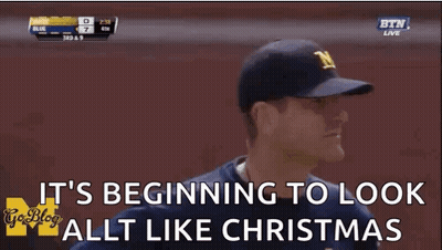 Man In Baseball Cap Saying It's Beginning To Look Like Christmas GIF