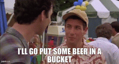 Man In Baseball Cap Talking To Another At Carnival GIF