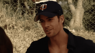 Man In Baseball Cap With Letter T GIF
