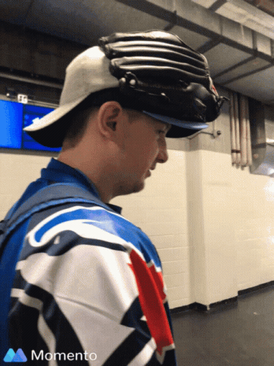 Man In Baseball Cap With Momento Logo Shirt GIF