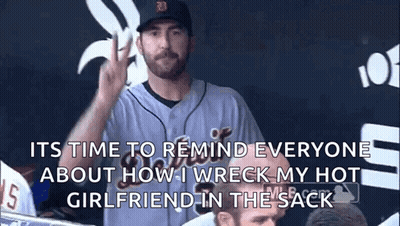 Man In Baseball Uniform Giving Peace Sign In Dugout GIF