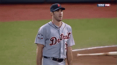 Man In Baseball Uniform Giving Peace Sign In Dugout GIF