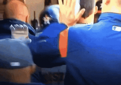 Man In Baseball Uniform Holding Baseball At Fence GIF