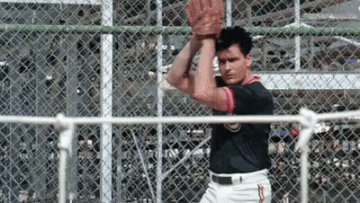 Man In Baseball Uniform Holding Baseball GIF