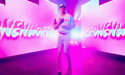 Man In Baseball Uniform In Front Of New York Wall GIF