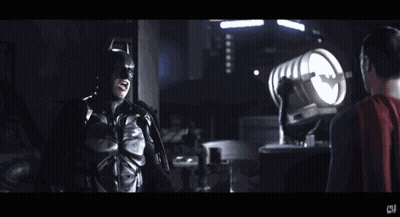 Man In Bat Suit Standing Next To Man In Red Cape Saying Now I'm A Bat GIF