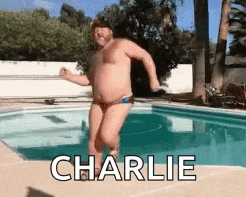 Man In Bathing Suit Jumping Into Pool GIF