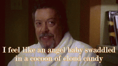 Man In Bathrobe Saying I Feel Like An Angel Baby Swaddled In A Cocoon Of Cloud Candy GIF