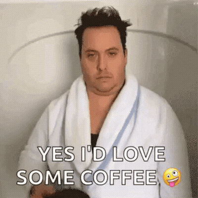 Man in Bathrobe Sitting in Bathtub Holding Coffee