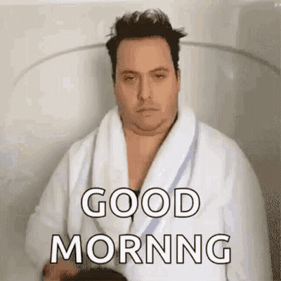 Man In Bathrobe Sitting In Bathtub Says Good Morning GIF