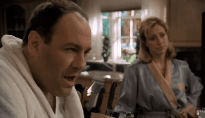 Man In Bathrobe Talking To Woman In Robe GIF