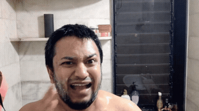 Man In Bathroom With Soap Sign GIF