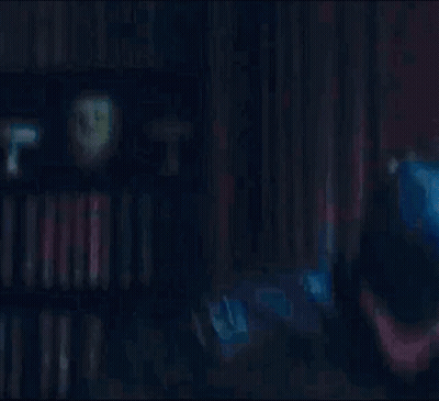 Man In Batman Costume Close Up Dark Room GIF