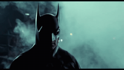 Man In Batman Costume Close Up Dark Room GIF
