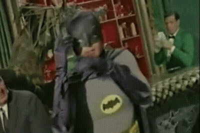 Man In Batman Costume Hands On Face GIF