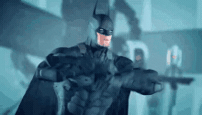 Man In Batman Costume Holding Gun GIF