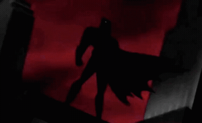Man In Batman Costume Holding Soda Can GIF