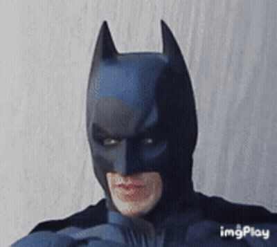 Man In Batman Costume Making A Face GIF