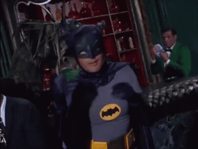 Man In Batman Costume Making Heart With Hands GIF