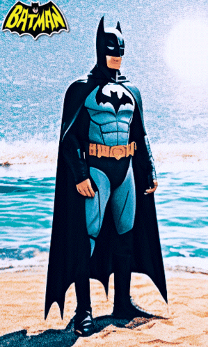 Man In Batman Costume Standing On Beach GIF