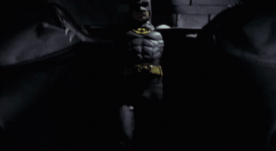 Man In Batman Costume With Yellow Bat GIF