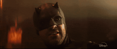 Man in Batman Mask With Disney Logo