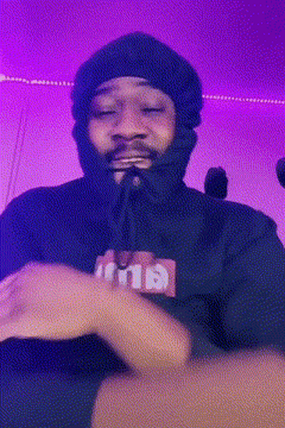 Man In Beanie And Black Hoodie Making Funny Face GIF