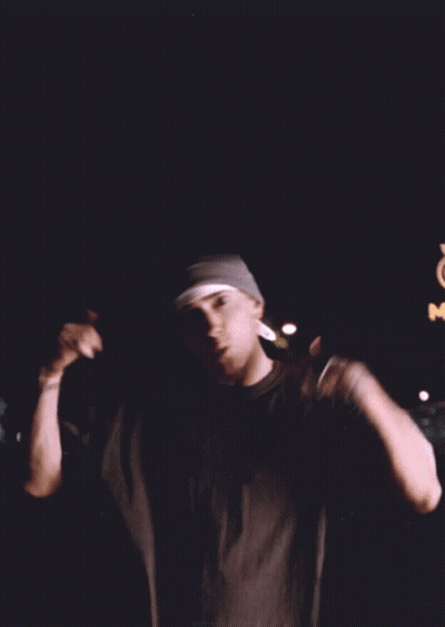 Man In Beanie And Black Shirt In Front Of McDonald's Sign GIF