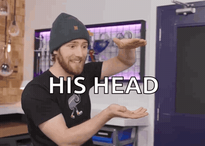 Man In Beanie And Black T-Shirt Saying His Head GIF