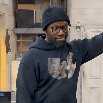 Man In Beanie And Glasses Wearing Wu Tang Hoodie GIF