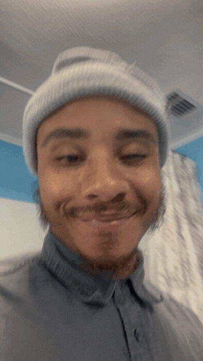 Man In Beanie And Gray Shirt Smiling GIF