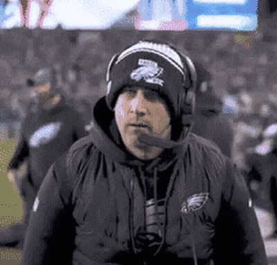 Man In Beanie And Headphones On Football Field GIF