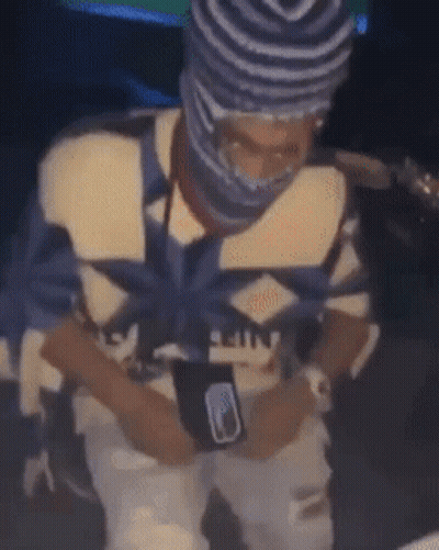 Man In Beanie And Mask Sitting GIF
