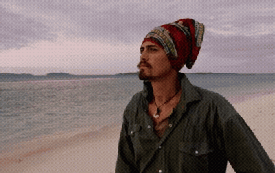 Man In Beanie And Necklace On Beach GIF