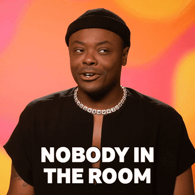 Man In Beanie And Necklace Saying Nobody In The Room GIF