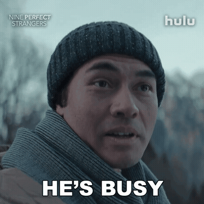 Man In Beanie And Scarf Says He's Busy GIF