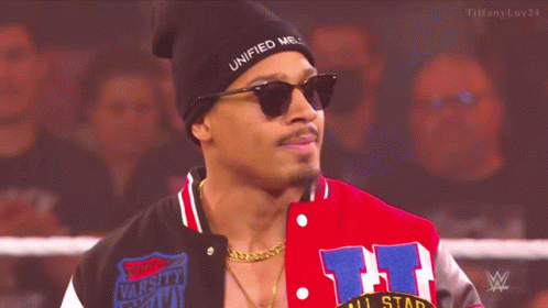 Man In Beanie And Sunglasses Standing In Wrestling Ring GIF
